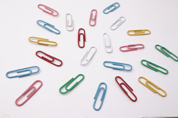 Colorful paper clip office business supplies isolated on white