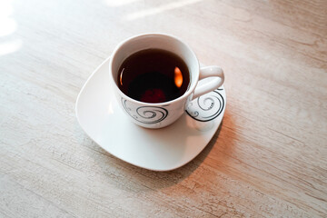 Cup of Black Tea (Coffee) on wooden background 