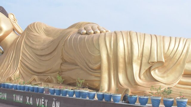 india's largest reclining sleeping buddha statue in bodh gaya by buddha international welfare mission  with caption,"love" written in vietnamese language