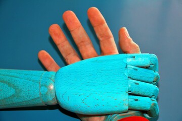 Robot hand winning against human hand. Arm wrestle .