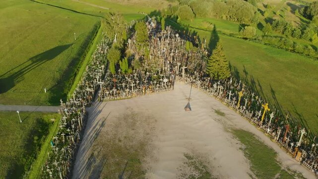 Aerial view of Kryziu kalnas, or the Hill of Crosses, a site of pilgrimage near the city of Siauliai, in northern Lithuania. Sunny summer evening.