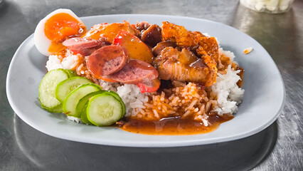 Red pork and crispy pork on rice, food in Thailand.