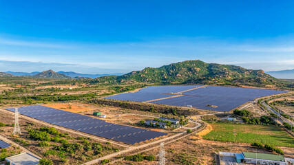 Aerial view of Solar panel, photovoltaic, alternative electricity source - concept of sustainable resources on a sunny day, Phuoc Dinh, Ninh Phuoc, Ninh Thuan, Vietnam