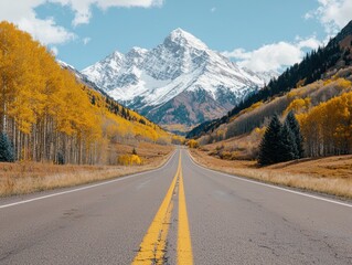 Breathtaking Scenic Route Through Autumn Landscape with Majestic Mountains in the Background