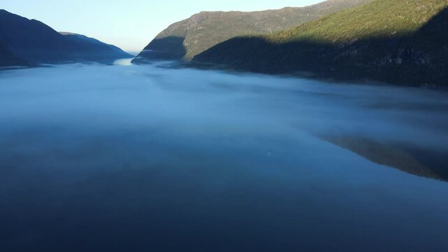 Early morning in Hardanger fjord. Drone footage