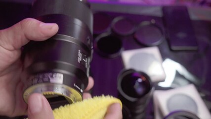 Cleaning various camera lenses with a cloth