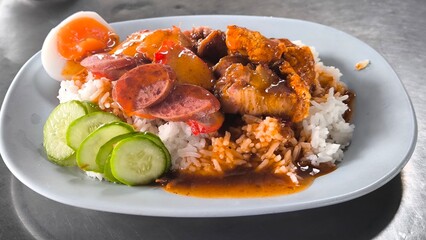 Red pork and crispy pork on rice, food in Thailand.