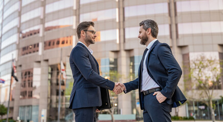 Two businessmen partner celebrating business deal. Successful partnership in business deal. Businessmen dealing outdoor. Partnership success. Celebrate business partnership. Banner