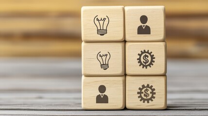 Wooden blocks with icons representing ideas, people, money, and gears, symbolizing business, creativity, and teamwork.
