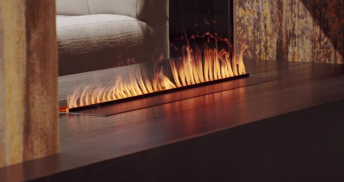 Close-up artificial electronic fireplace burning with smoke fire. Bio fireplace burn. Modern smart ecological alternative technologies Interior design of house inside. Electric modern fireplace