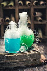 Alchemist laboratory full of ancient scrolls and chemical flask
