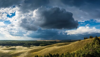 Obraz premium beautiful stormy clouds, blue sky and sunshine, sky clearing after rain