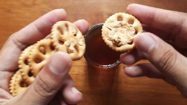 various kinds of biscuits that are usually eaten at breakfast accompanied by a glass of hot coffee on a white plate