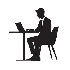 Silhouette of a businessman working on a laptop at a desk.