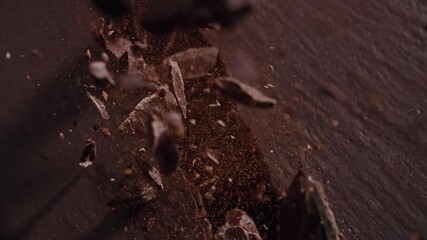 Slow motion of chocolate block explosion pieces flying