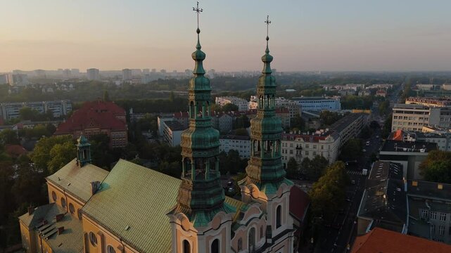 Aerial view of historic tourist center of Poznan and spires of St. Francis church on an early summer morning, Poland