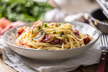 Traditional Italian spaghetti with prosciutto, mushrooms and parmesan