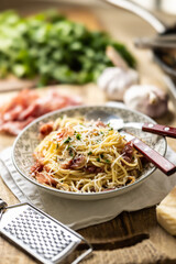 Traditional Italian spaghetti with prosciutto, mushrooms and parmesan