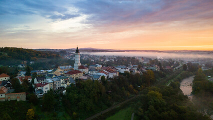 Aerial drone view of Biecz medieval townscape at foggy sunrise, Poland