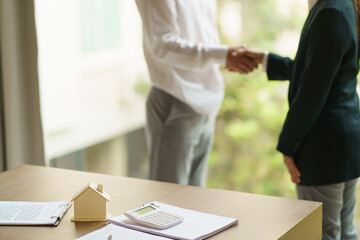 Business people signing contract making deal with real estate agent Concept for consultant home insurance.Real estate investment Property insurance security. Real estate agent offer house.