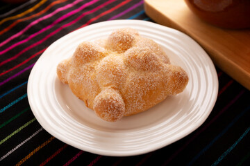 Pan de Muerto. Typical Mexican sweet bread that is consumed in the season of the day of the dead. It is a main element in the altars and offerings in the festivity of the day of the dead.
