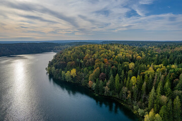 Aerial autumn morning view of colouful trees, forest, Green lakes (Zalieji ezerai) in Vilnius, Lithuania