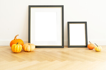 Warm and delightful autumn decor that features charming frames and pumpkins, ideal for creating...