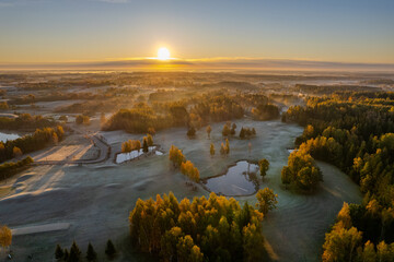 Aerial autumn morning sunrise view of forest and lakes, golf course, Vilnius, Lithuania