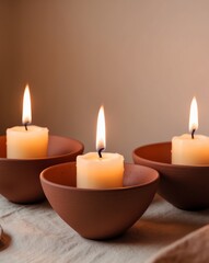 Burning Candles in Clay Bowls with Warm Ambient Light.