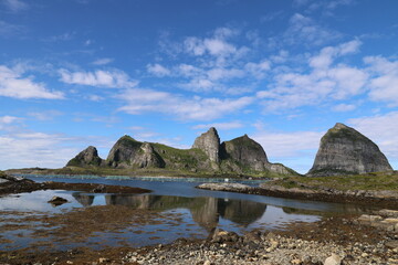 Fototapeta premium View of the fantastic rocks of the Sorsannaan Island reflected in the sea, Norway