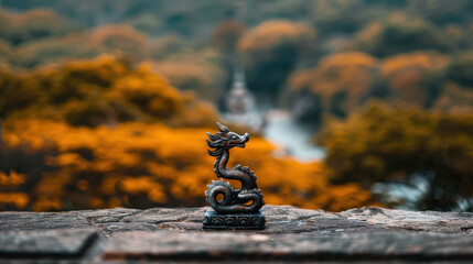 Obraz premium detailed shot of colorful naga statue coiling gracefully, set against blurred backdrop of vibrant autumn foliage. serene atmosphere evokes sense of tranquility and wonder