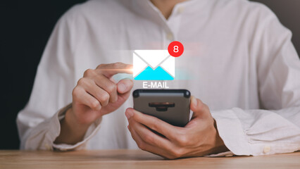 man reading electronic mail ,Email marketing and newsletter concept,Digital communication with email messages,Sending and receiving messages online with the email icon ,notifications