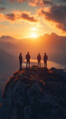 A group of four people are standing on a mountain peak