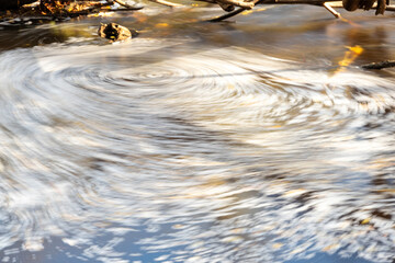stream water stream forms a blurred circle, beautiful natural environment as background, blurred water stream