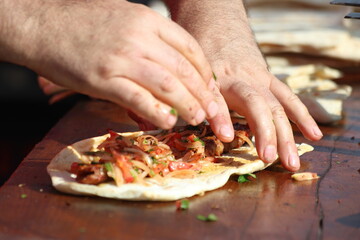 preparation of adana kebap which is grilled lamb minced meat on skewer. Famous dish in Turkey