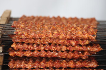 skewered lamb mince meat (adana kebap) ready to grill. 