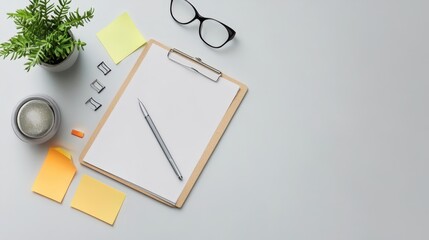 Minimalist office desk with clipboard, pen, and office supplies