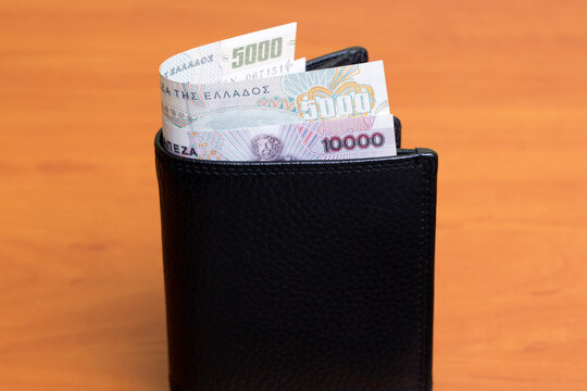 Greek drachma in the black wallet
