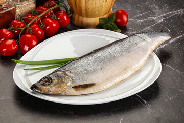 Whole raw salted herring fish