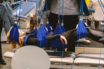 Physiotherapy frame with weight relief. Sling therapy.