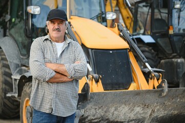 Construction driver with excavator on the background