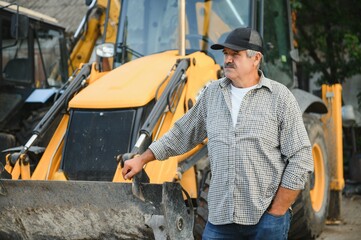 Construction driver with excavator on the background