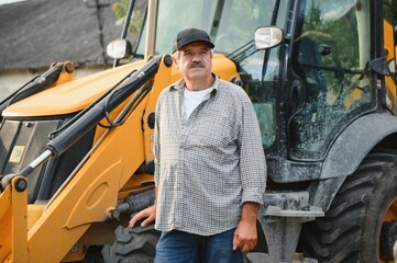 Construction driver with excavator on the background