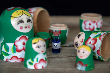 A tiny vial of poison hidden within Babushka wooden dolls