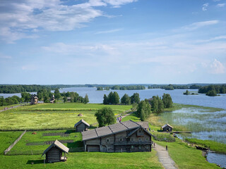 Obraz premium Landscape with the Lake Onega and the old buildings of the Kizhi open air museum, Karelia, Russia, June 2019