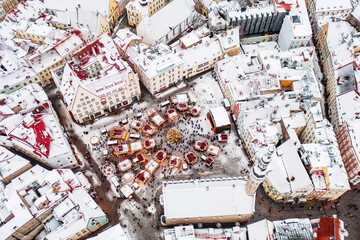 Aerial View of Tallinn with the Town Hall Square in winter, roofs with snow, Christmas mood