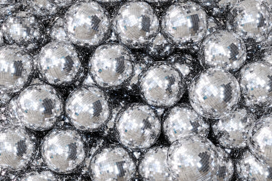 Many disco balls forming festive new year background