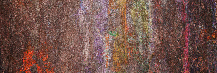Dirty color paint on a metal surface. Banner of the grunge color paint.