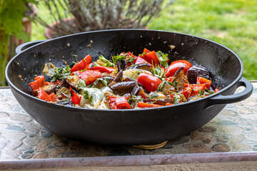 Grilled vegetable salad with zucchini, eggplant, onion, pepper and tomato