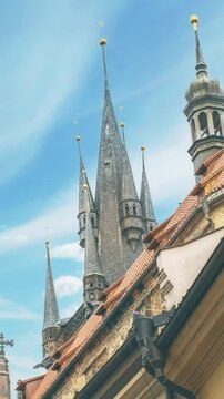Close-up of the tower of the Church of Our Lady before Tyn. The spiers of the ancient European historical cathedral in Prague. Landmark against the sky.